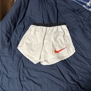 Nike White Athletic Running Shorts with Red Swoosh